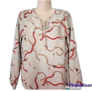 - Baby blue chain detail blouse from a collection with electric wrist